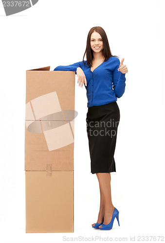 Image of businesswoman with big boxes