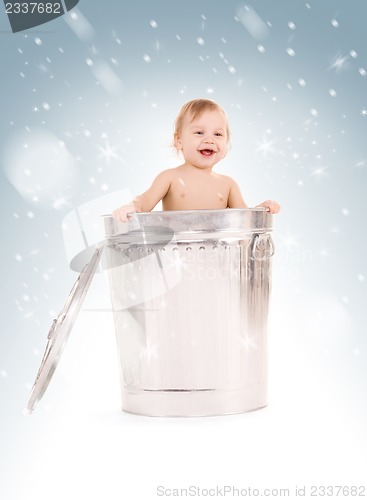 Image of baby in trash can