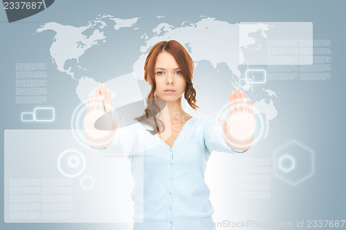 Image of businesswoman working with touch screen