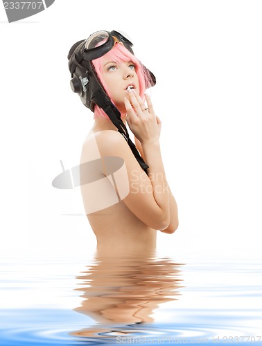 Image of topless pink hair girl in aviator helmet