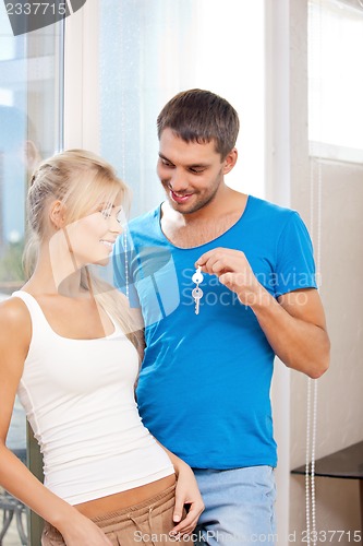 Image of happy couple with keys