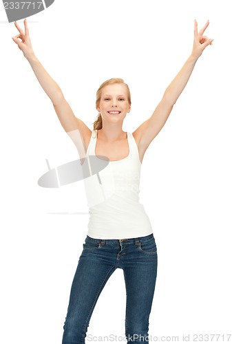 Image of girl in blank white t-shirt showing victory sign