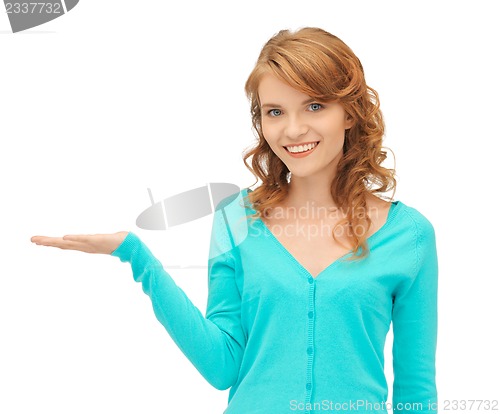 Image of girl showing something on the palm of her hand