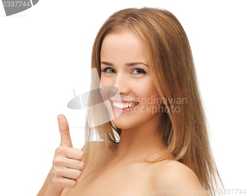 Image of beautiful woman showing thumbs up