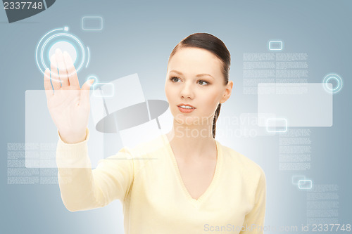 Image of businesswoman working with touch screen