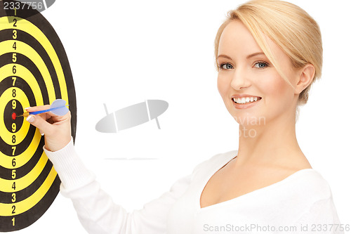 Image of businesswoman with dart and target