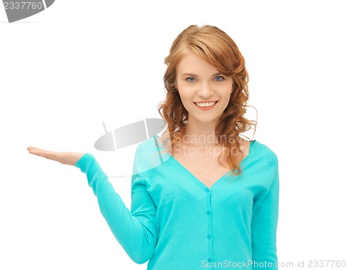 Image of girl showing something on the palm of her hand