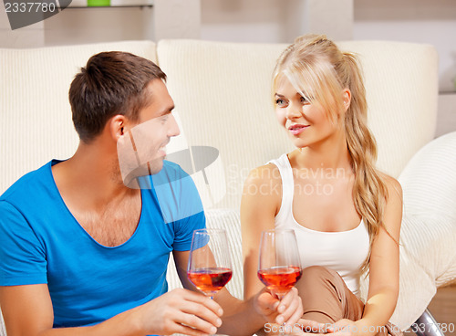 Image of romantic couple drinking wine