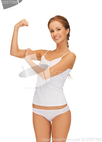 Image of woman in cotton undrewear flexing her biceps