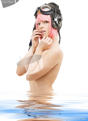 Image of topless pink hair girl in aviator helmet