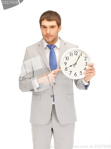 Image of handsome man with clock