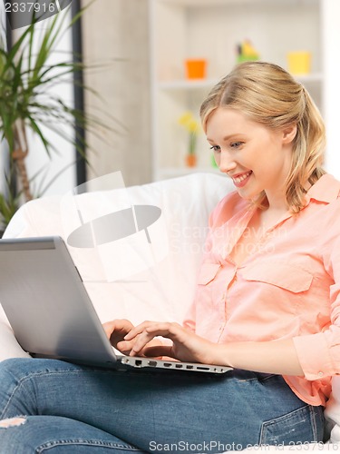 Image of happy woman with laptop computer