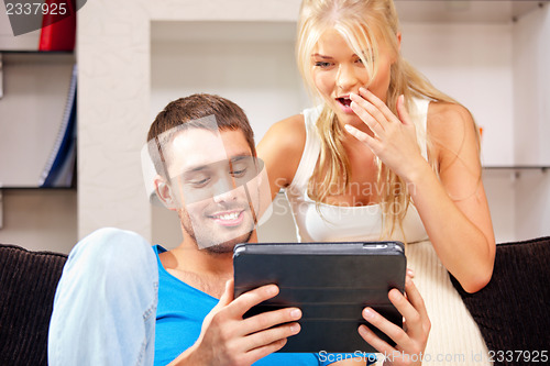 Image of happy couple with tablet pc computer