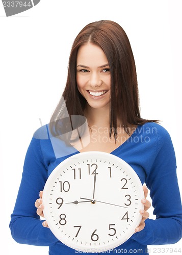 Image of woman holding big clock