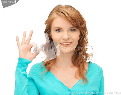 Image of teenage girl showing ok sign
