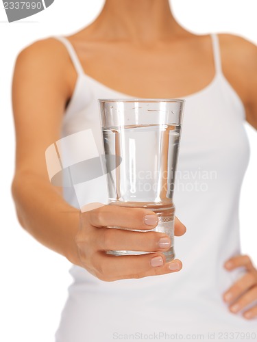 Image of woman hands holding glass of water