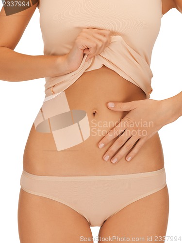 Image of woman body in beige cotton undrewear