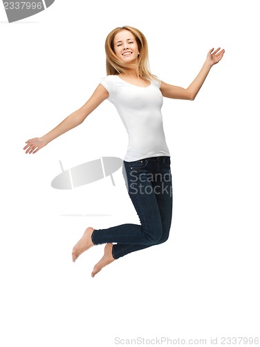 Image of jumping teenage girl in blank white t-shirt