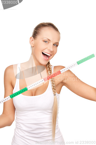 Image of young beautiful woman with measure tape