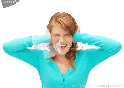 Image of student with hands on ears