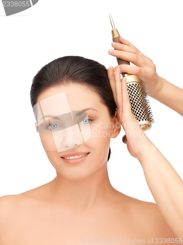 Image of beautiful woman with comb