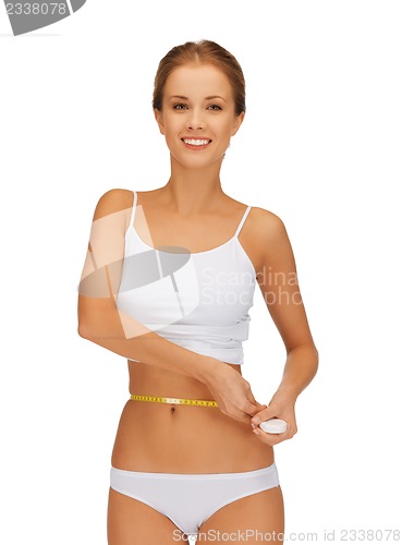 Image of woman measuring her waist