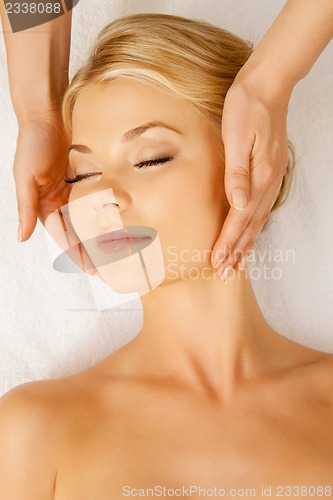 Image of beautiful woman in massage salon