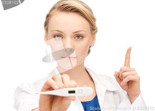 Image of attractive female doctor with thermometer