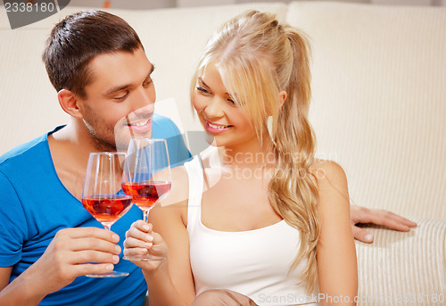 Image of romantic couple drinking wine