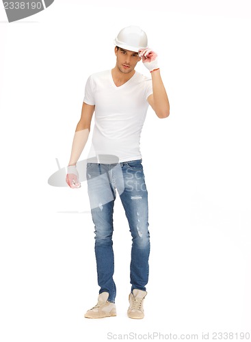 Image of handsome builder in helmet