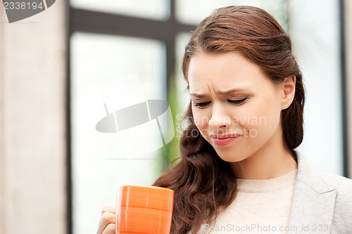 Image of lovely businesswoman with mug