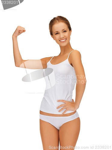 Image of woman in cotton undrewear flexing her biceps