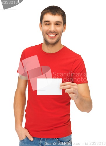 Image of handsome man with note card