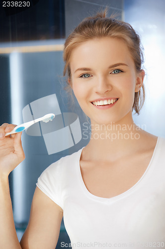 Image of smiling teenage girl with toothbrush