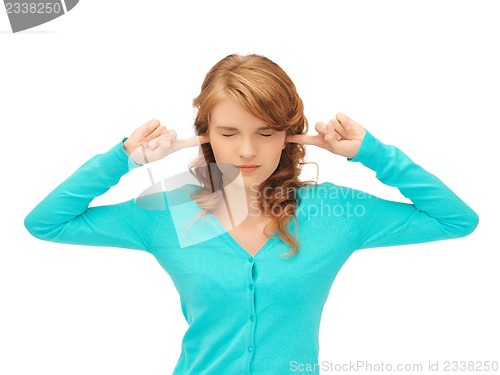 Image of student with fingers in ears