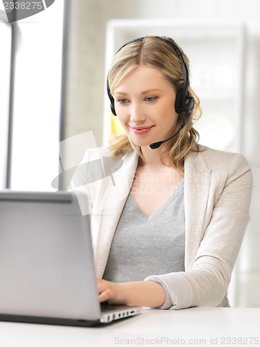Image of helpline operator with laptop computer