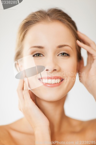 Image of face and hands of beautiful woman