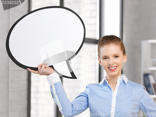Image of smiling businesswoman with blank text bubble