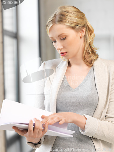 Image of calm woman with documents