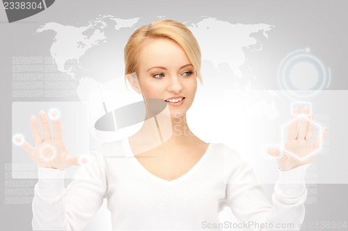 Image of businesswoman working with touch screen