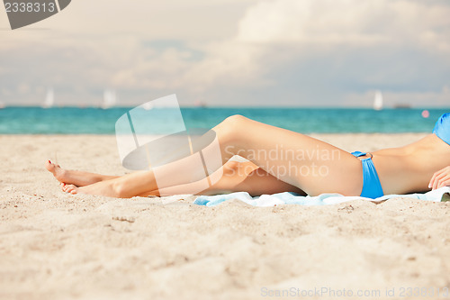 Image of picture of female legs and bikini