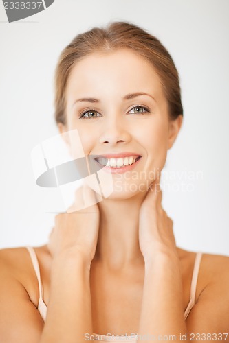 Image of face and hands of beautiful woman