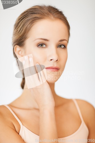 Image of face and hands of beautiful woman