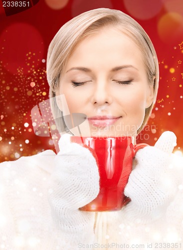 Image of beautiful woman with red mug