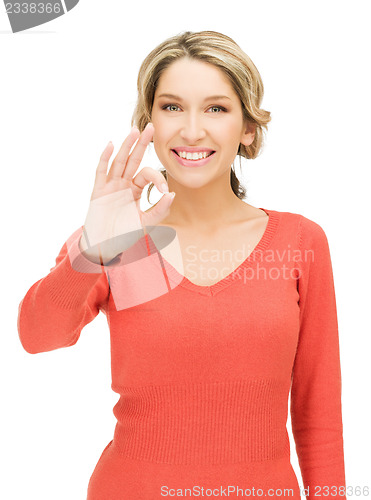Image of young woman showing ok sign
