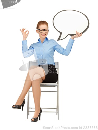 Image of smiling businesswoman with blank text bubble