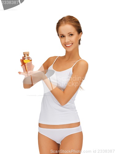 Image of woman with oil bottle