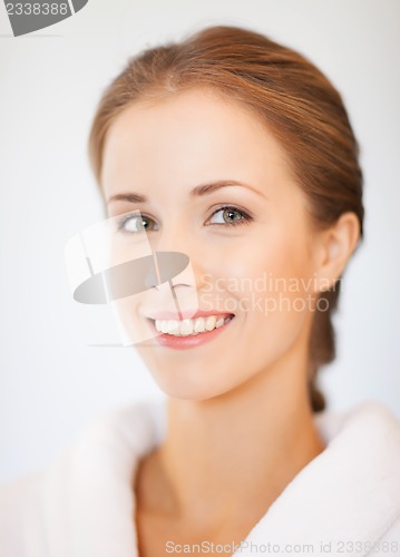 Image of beautiful woman in bathrobe