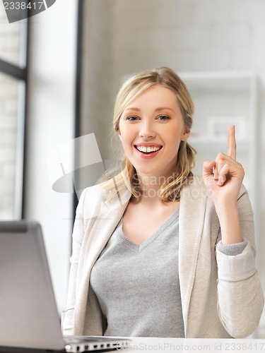 Image of woman with laptop and finger up