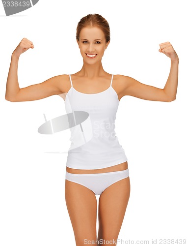 Image of woman in cotton undrewear flexing her biceps